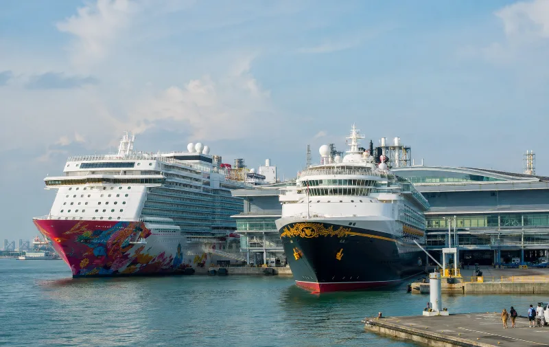 Genting Dream and Disney Adventure cruise ships compared at Marina Bay Cruise Centre Singapore