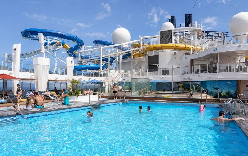 Genting Dream pool deck and waterslides included in the cruise fare
